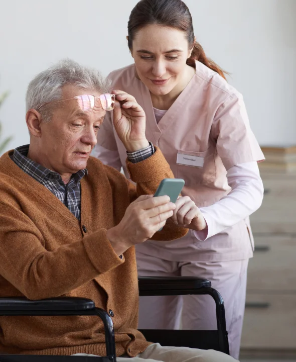 Nurse assisting elderly patient